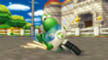 Yoshi drifting on his Mach Bike in Mario Kart Wii