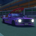 A truck carrying a surfboard on N64 Toad's Turnpike in Mario Kart 8 Deluxe