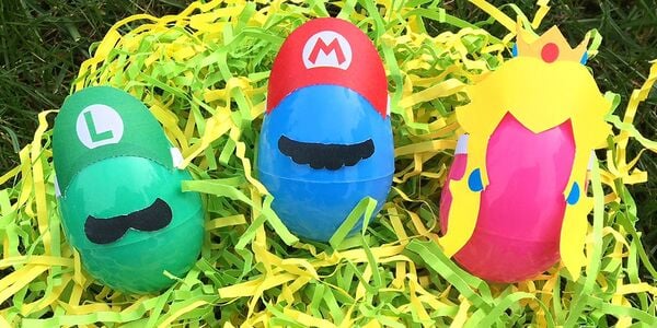 Photograph of several plastic eggs with Mario-themed decorations