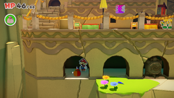 Mario standing near a Small Bag of Confetti in Picnic Road of The Origami King.