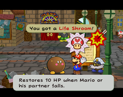 Mario getting a Life Shroom from Lucky in Rogueport of Paper Mario: The Thousand-Year Door.