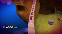 Mario climbing a wooden wall in Honeyhive Galaxy, collecting Purple Coins.