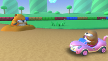 Screenshot of SNES Donut Plains 2 in Mario Kart Tour, featuring Monty Mole driver in the Cat Cruiser and an on-course Monty Mole.