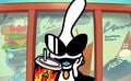 Orbulon drinking a Chili Shake in front of a sign.