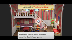 Mario getting the Platinum Card from Toodles in Poshley Heights of Paper Mario: The Thousand-Year Door for Nintendo Switch.