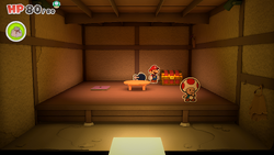 Mario standing near a chest containing a Coin in Shogun Studios of The Origami King.