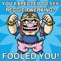 Image macro featuring Game & Wario artwork of Wario, used by the official Nintendo of America Twitter account as a bait-and-switch for users interested in seeing Reggie Fils-Aimé twerk