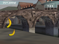 Two Rattlys are engraved on a bridge in the "Port City - Foggy Morning" background, shown in Freestyle Zone of Donkey Konga 2.