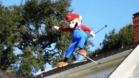 The Mario Mascot skiing on a roof in a commercial for Mario Party 4, possibly representing the Minigame Avalanche!