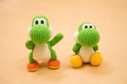 Two Yoshi puppets with different arm lengths