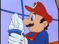 Mario holds a piece of Shrinking Sukiyaki in the "Mario Meets Koop-zilla" episode of The Super Mario Bros. Super Show!.