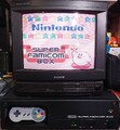 The Super Famicom Box kiosk hooked up to a CRT television featuring Kirby