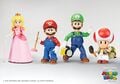 Poseable action figures of Peach, Mario, Luigi, and Toad