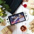 Merry Mountain shown on a Nintendo Switch – OLED Model in a holiday 2022 photograph from Nintendo of America's social media accounts