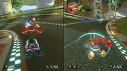 Wario in Battle Mode of Mario Kart 8.