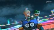 Rosalina, racing on the track, while holding a Green Shell