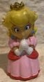 A finger puppet of Princess Peach from Mario Party 7 by Tomy
