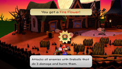 Mario getting a Fire Flower from a bush in Twilight Town of Paper Mario: The Thousand-Year Door for Nintendo Switch.