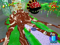 A Petey Piranha head rolls down the path of Bianco Hills in an early Super Mario Sunshine.