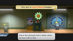 Mario getting the Last Stand badge from an open crate in Glitz Pit of Paper Mario: The Thousand-Year Door for Nintendo Switch.