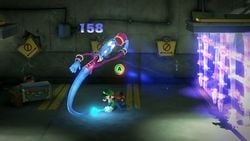 Luigi battling the Steward in the Basement of The Last Resort in Luigi's Mansion 3.