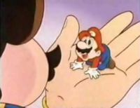 Super Mario Issun-bōshi: Papa holds Mario in the palm of his hand.