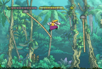 Wario explores the Jiggle Jungle in Wario Land: Shake It!