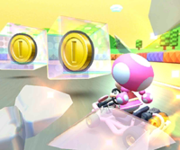 The icon of the Toadette Cup challenge from the Baby Rosalina Tour and the Shy Guy Cup challenge from the Wedding Tour in Mario Kart Tour