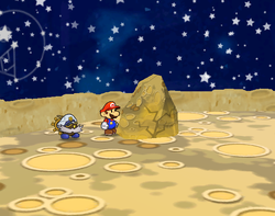 Mario near the rock containing a Stopwatch on the Moon of Paper Mario: The Thousand-Year Door.