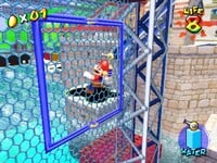 Mario climbs a Fence in Ricco Harbor in an early Super Mario Sunshine.
