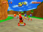 Diddy Kong begins a race in Ancient Lake in Diddy Kong Racing DS. The level's Wish Key can be seen in the distance.