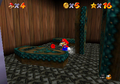 Mario finds a red coin under a coffin