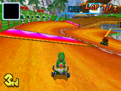 Yoshi driving toward a Dash Panel in Yoshi Falls of Mario Kart DS
