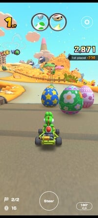 Yoshi driving towards three spring eggs on the Yoshi's Island course