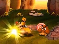 Bowser battling a Chuboomba in Mario & Luigi: Bowser's Inside Story + Bowser Jr.'s Journey