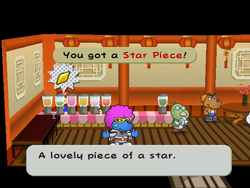 Mario getting the Star Piece in the juice shop of Glitzville in Paper Mario: The Thousand-Year Door.