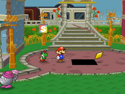Mario getting the Star Piece under a hidden panel in the open area in front of the station in Poshley Heights in Paper Mario: The Thousand-Year Door.