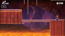 Screenshot of Fire Mountain level 3-3 from the Nintendo Switch version of Mario vs. Donkey Kong