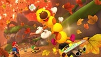 Screenshot of Wiggler racing on Wii Maple Treeway in Mario Kart 8 Deluxe.