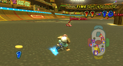 Funky Kong competes in a Coin Runners battle at Funky Stadium, in Mario Kart Wii.