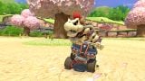 Dry Bowser races past a set of trees