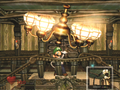Luigi uses his Poltergust 3000 on the Foyer's chandelier.