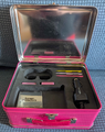 Interior of the Super Princess Peach-themed Nintendo DS carrying tin, with some bundled accessories (Pictured: Two game cartridge holders, 3 styluses, a Nintendo DS car charger, and a set of screen protectors. Not pictured: A pair of headphones, and a sticker for the Nintendo DS' top screen.[4])