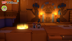 Mario standing on a patch of sand containing a Small Bag of Confetti in Temple of Shrooms of The Origami King.