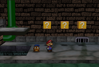 Mario and Goombario in the passage between the entrance and the west areas in Toad Town Tunnels