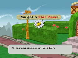 Mario getting the Star Piece behind the hedge to the right of the entrance of the second scene of Poshley Heights in Paper Mario: The Thousand-Year Door.