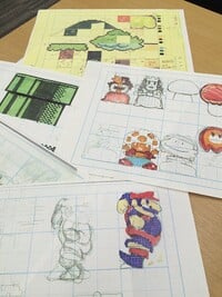 Various pieces of concept art for Super Mario Bros. on the Famicom that feature (clockwise from left): a Warp Pipe, platforms, background elements, Princess Toadstool, a Magic Mushroom, a Podoboo, a mushroom retainer, and Super Mario.