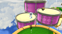 Mario on the drums in the Cloudy Court Galaxy