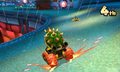 Bowser, racing on the 180°degree turns at Neo Bowser City.