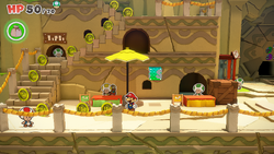 Mario standing near 14 100-Coins in Picnic Road of The Origami King.
